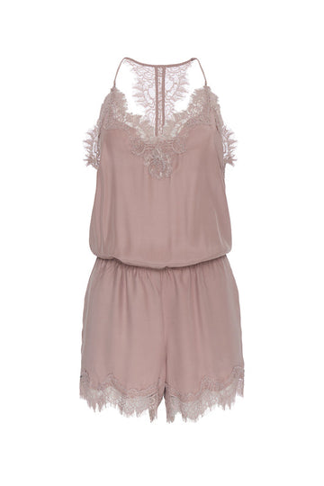 The Coco Lace Romper in muted rose.