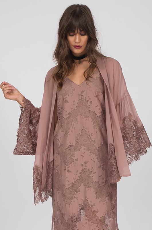 Model is wearing the Coco Silk Lace Kimono in rose taupe, opened, with the Suzy Zig Zag Lace Dress in rose taupe underneath.