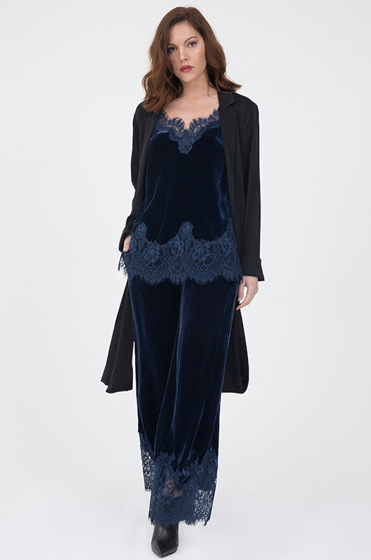 Model is wearing the Anastasia Lace Trim Velvet Cami in navy with Anastasia Lace Velvet Robe in navy and the Anastasia Lace Velvet Pants in navy. Also worn with black ankle high heel boots.