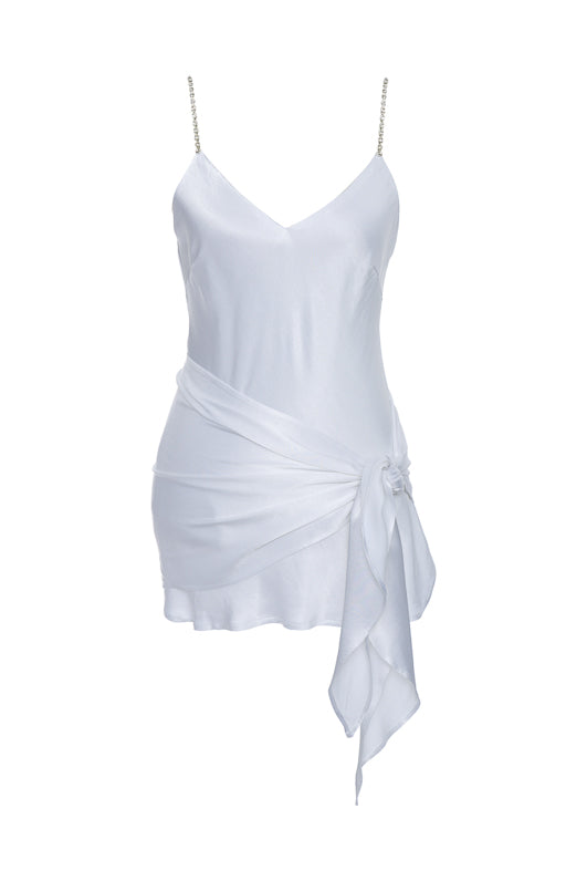 The Aimee Camisole in bright white, with matching sash tied around the waist.