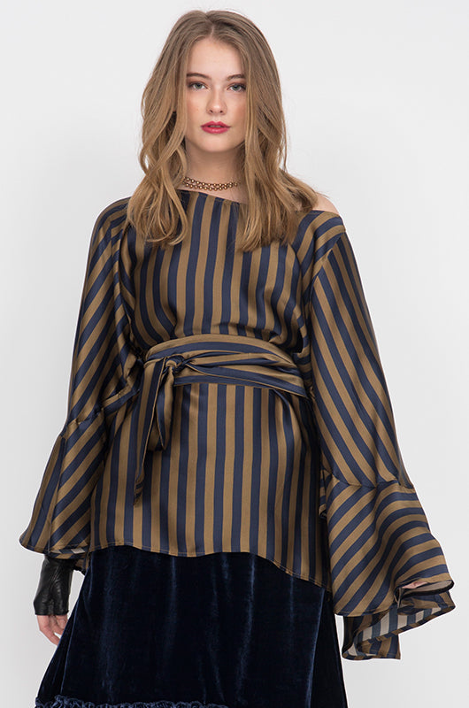 Model is wearing the Stripe Silk Batwing Top with matching sash used as belt, on top of the Anastasia Lace Velvet Dress in navy.