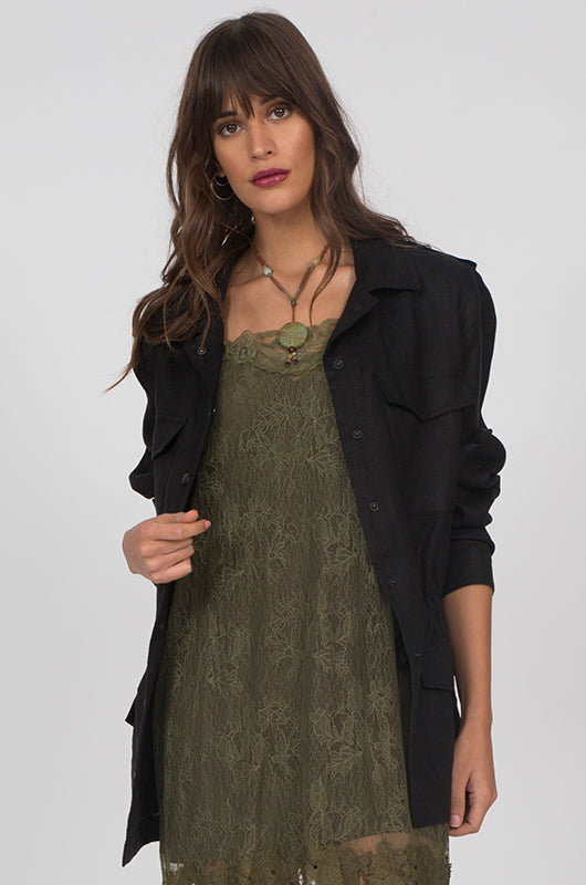 Model is wearing the Linen Army Jacket in black with an olive dress.