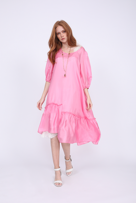 Model is wearing the Maine Peasant Dress in rose, without sash, and with the Megan Coco Dress in white underneath. Also worn with open toe, ankle strap, white high heels.