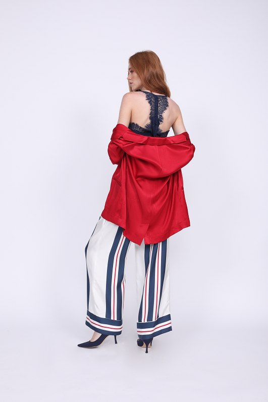 Model is wearing the Hayley Blazer in fiery red with the Lucy Crop Cami in navy underneath. Also worn with the Bold Stripe Pant in navy and blue suede, pointed toe kitten heels.