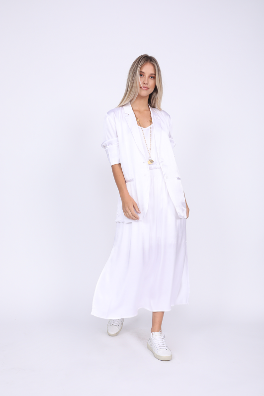 Model is wearing the Hayley Blazer in bright white with the Hayley Tank Dress in bright white. Also worn with white sneakers.