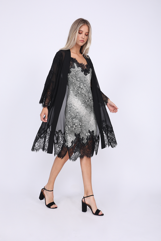 Model is wearing the Python Coco Print Silk Slip Dress in grey python with the Coco Lace Silk Kimono in black. Also worn with open toe, ankle strap, black high heels.