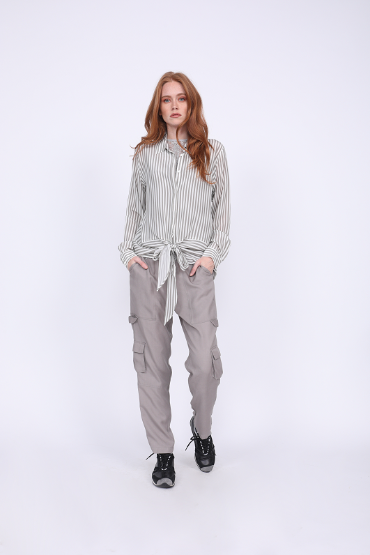 Model is wearing the Mini Stripe Shirt in steeple grey with the Zoe Coco Camisole in ice grey, and the Tencel Cargo Pant in steeple grey with black sneakers.