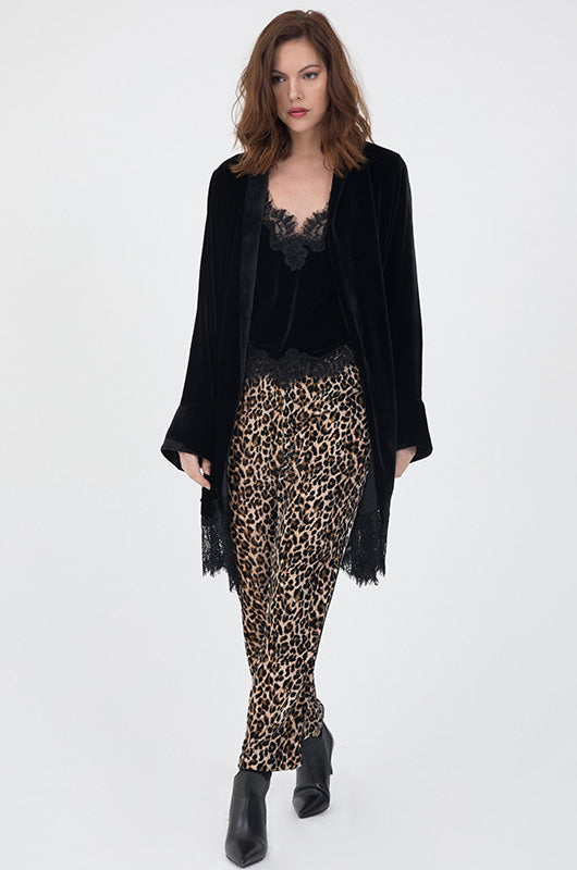 Model is wearing the Animal Print Velvet Ginger Piping Pants with the Lucy Crop Cami in black and the Anastasia Lace Velvet Robe in black. Also worn with black, pointed toe, ankle high heel boots.